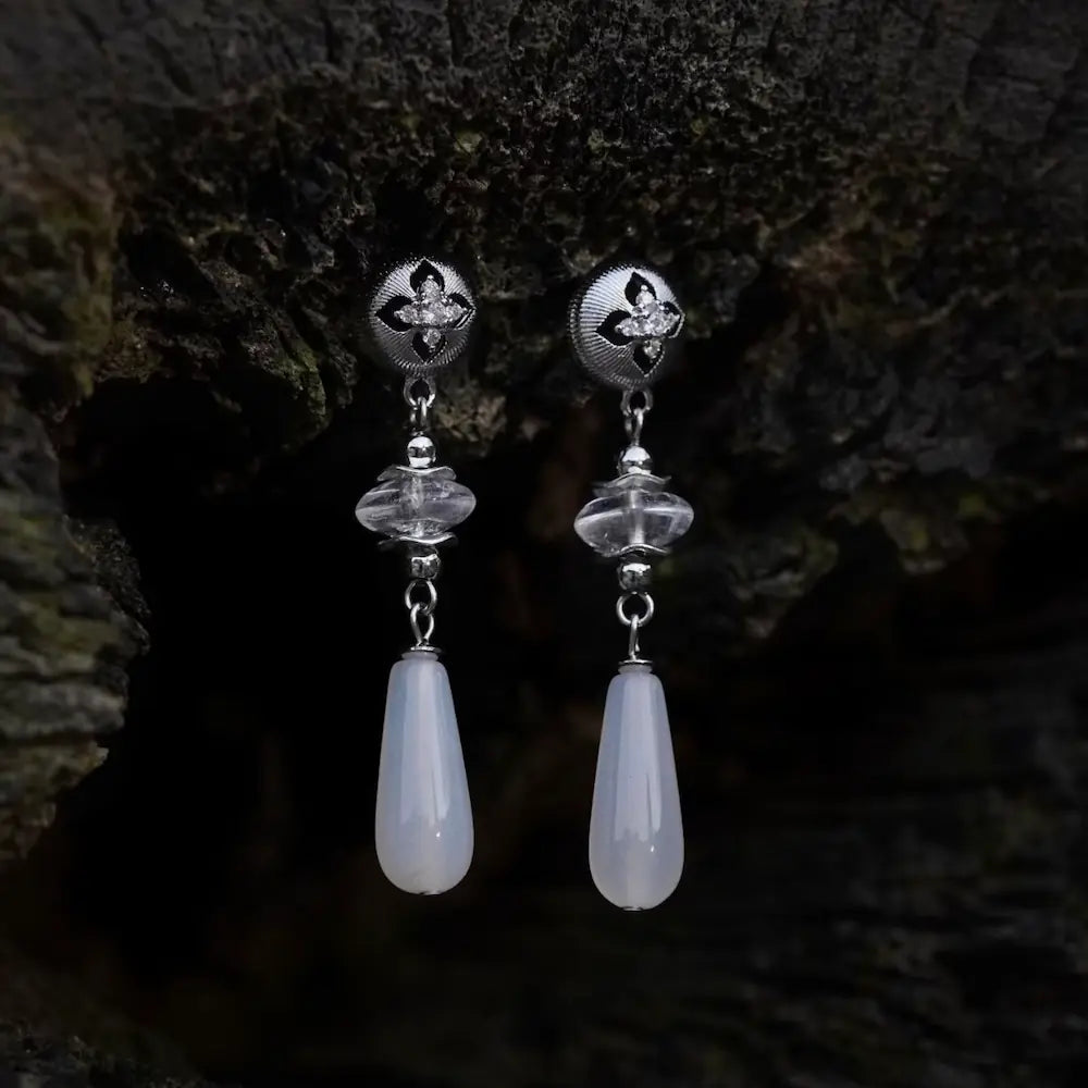 Silver-plated cloisonne leaf earrings with white crystal and agate on dark wood background Orienlu