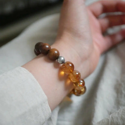 Citrine and sandalwood beaded bracelet worn with neutral-toned outfit — Orienlu