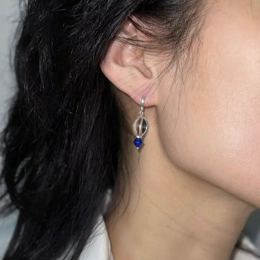 Hoop earrings with crystal and lapis lazuli worn in natural light Orienlu