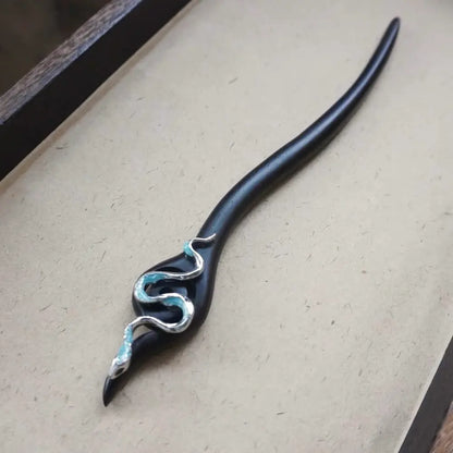 Handcrafted ebony wood snake hair pin displayed on neutral background Orienlu