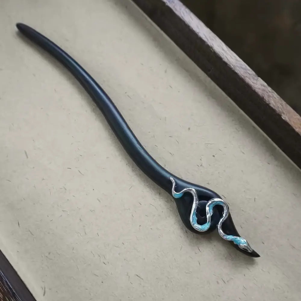 Handcrafted ebony wood hair stick with silver snake ornament trimmed in blue Orienlu