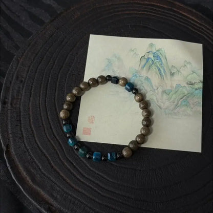 Handcrafted blue tiger eye bracelet with ancient bog wood and smoky quartz beads — Orienlu |