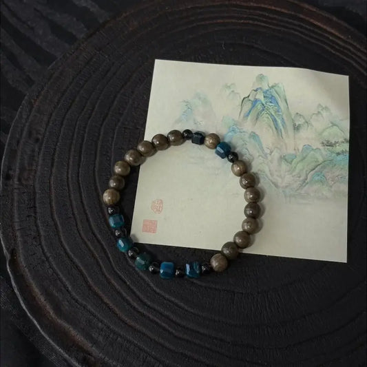 Handcrafted blue tiger eye bracelet with ancient bog wood and smoky quartz beads — Orienlu |