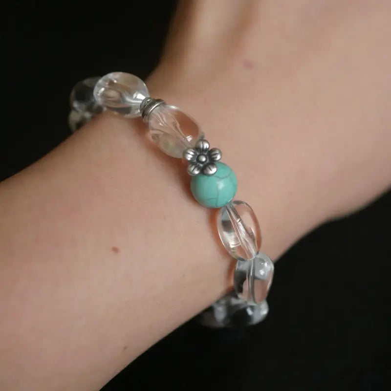 White quartz bracelet worn on wrist 
