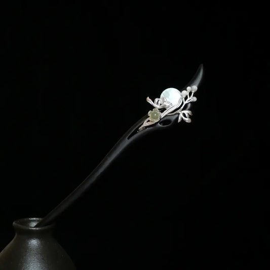 Orienlu official main product image of an 18cm ebony wood hair stick, featuring a silver-plated vine design with a round white mother of pearl moon and a carved green Hetian jade flower charm.