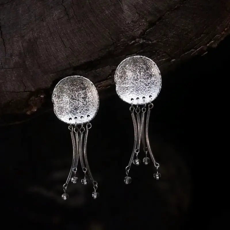 Handcrafted jellyfish earrings with hammered silver disc and crystal drop tendrils — Orienlu 