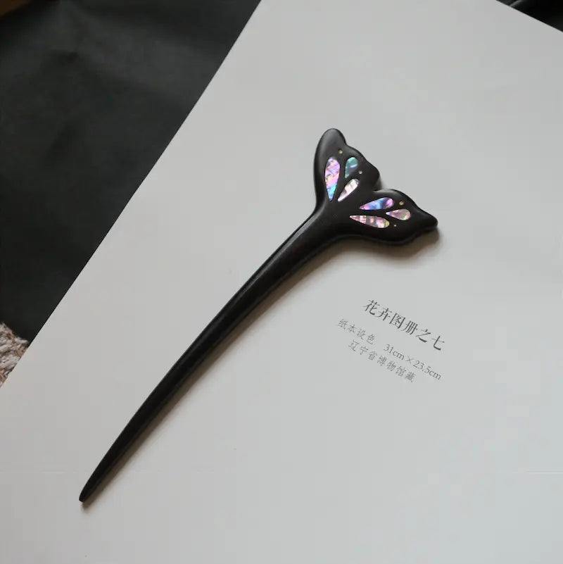 Orienlu official main product image of a neo-Chinese style ebony wood hair stick, featuring a ginkgo leaf shaped design inlaid with iridescent mother of pearl shell pieces on a white paper background.