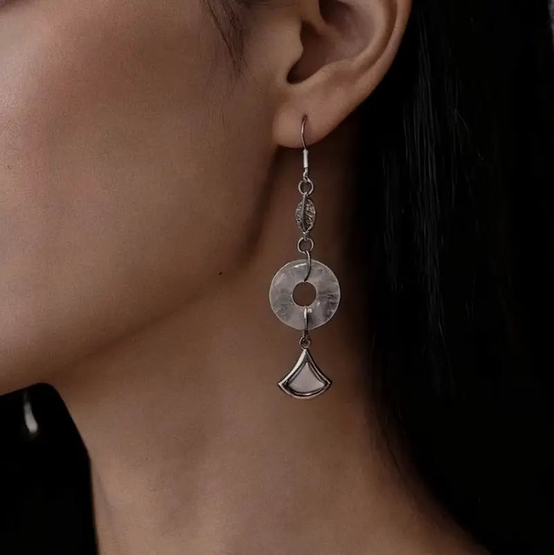 Rose quartz drop earrings worn on ears 
