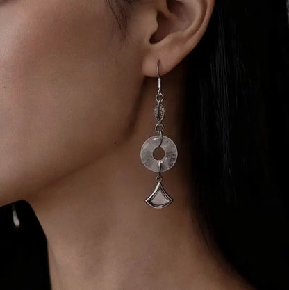 Rose quartz drop earrings worn on ears 