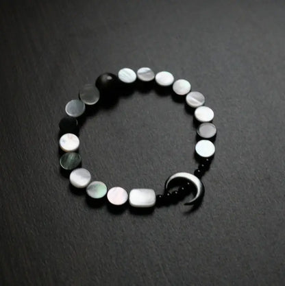 Handcrafted moon bracelet with mother of pearl disc beads and silver sheen obsidian — Orienlu |