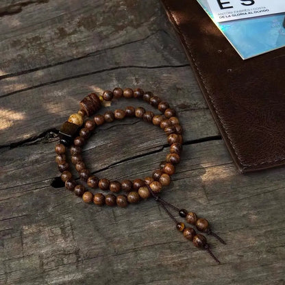 Handcrafted rosewood and tiger eye double loop bracelet with ebony and picture jasper accent beads on wooden background — Orienlu