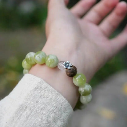 Xiuyu jade zen bracelet worn with minimalist outfit — Orienlu